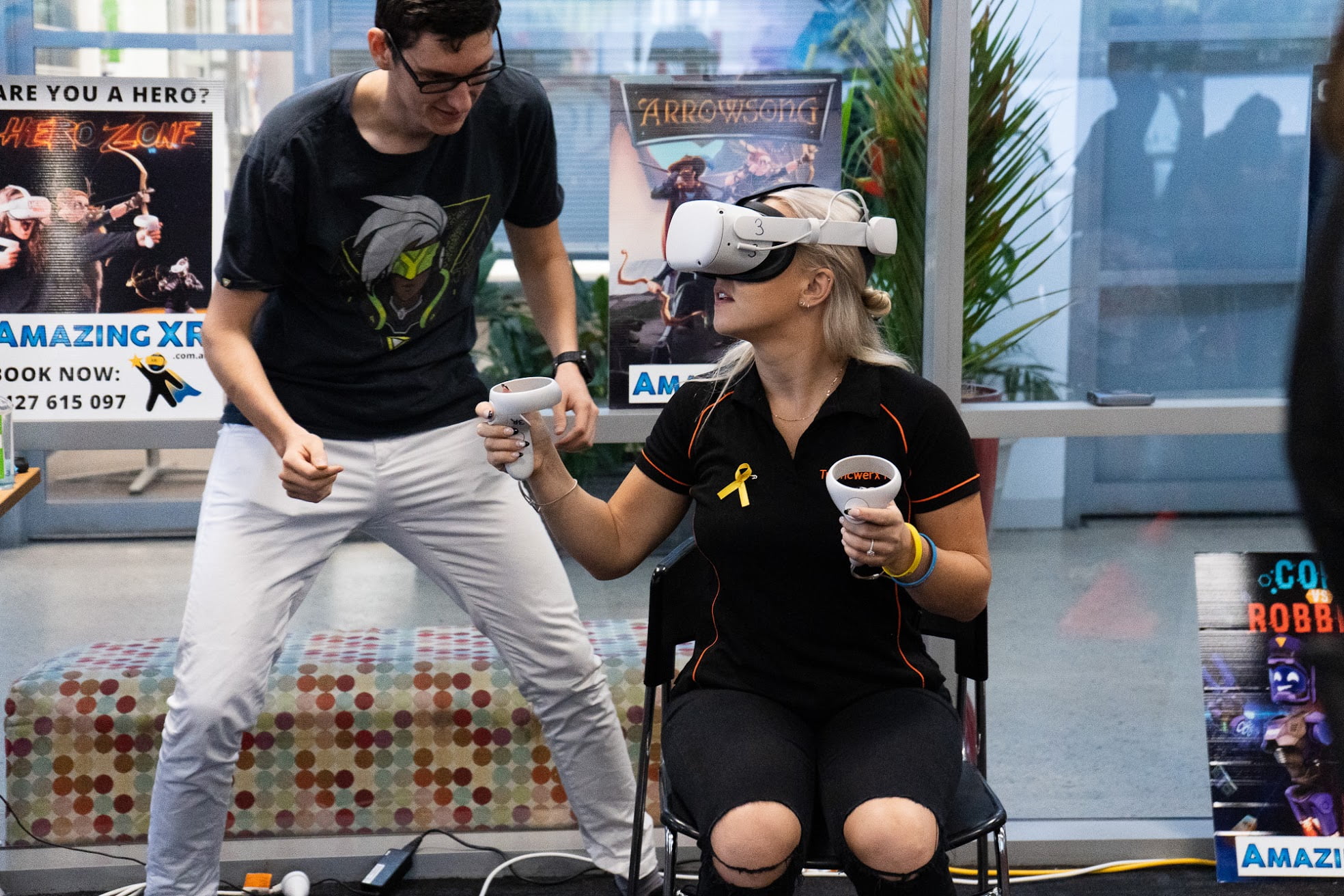 Developer Zephyr Dobson Talks A Woman Through A Virtual Reality Game